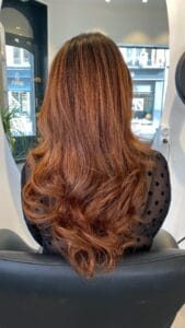 Réalisation couleur cuivre profond – reflets chauds et naturels à Lille par nos experts coloristes
