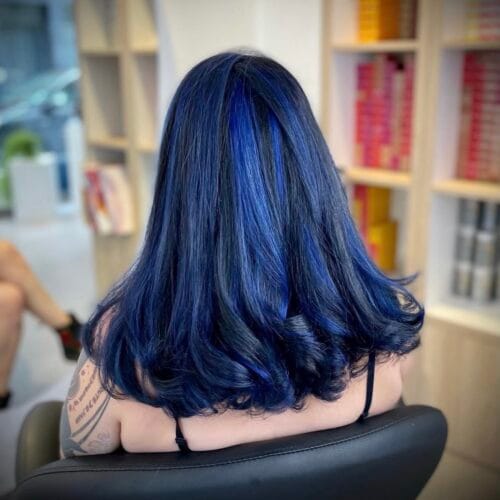 Transformation balayage intense : éclaircissement fondu bleue par votre coiffeur Lille